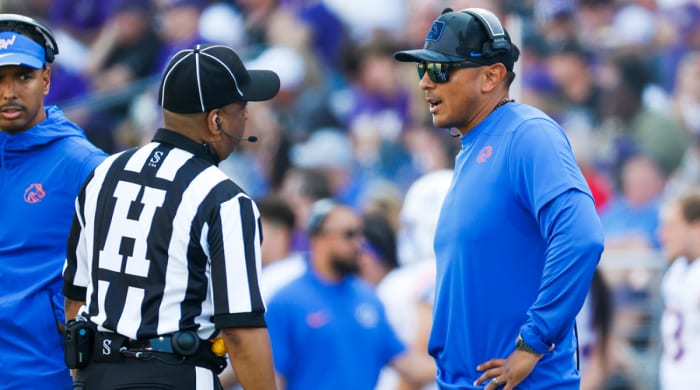 Boise State coach Andy Avalos talks with a referee during a second quarter timeout against Washington at Alaska Airlines Field at Husky Stadium.